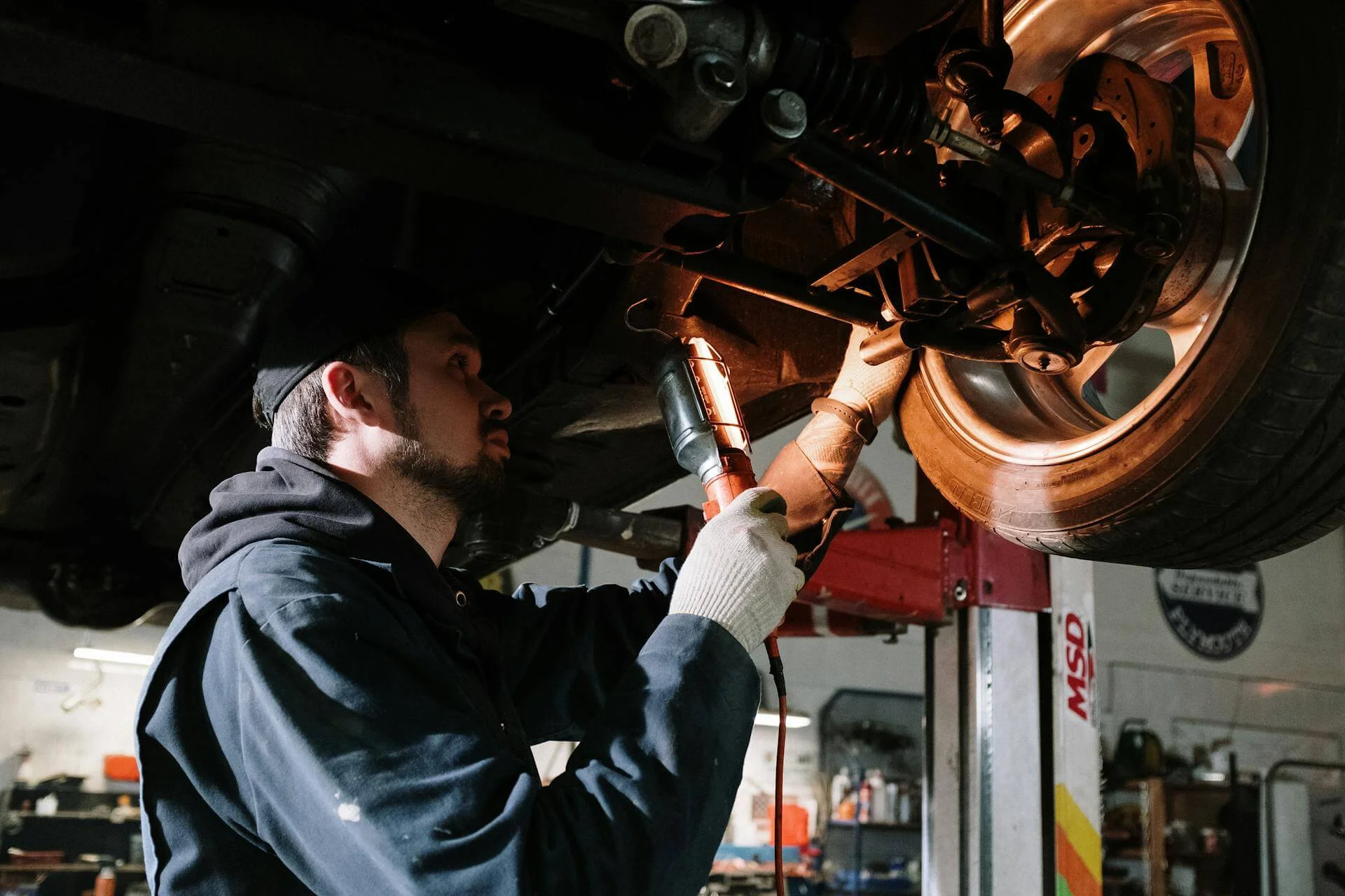 A man detailing a car.